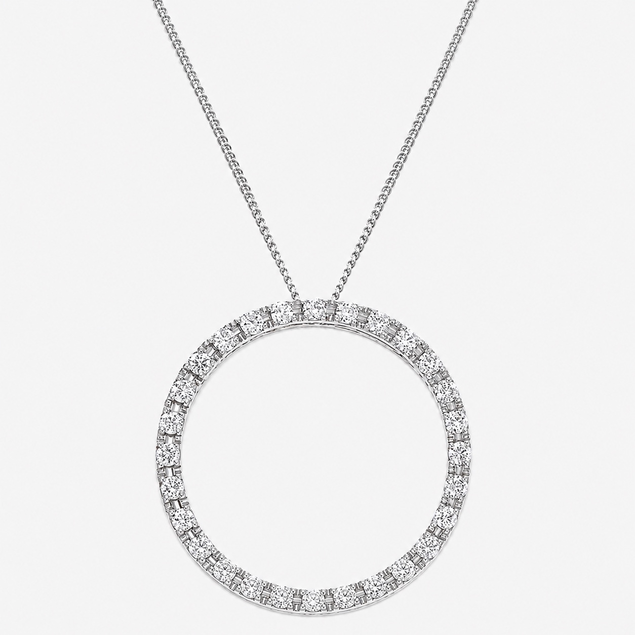 A fine 18ct white gold Circle of Life pendant, a slender diamond-set circle on a fine chain