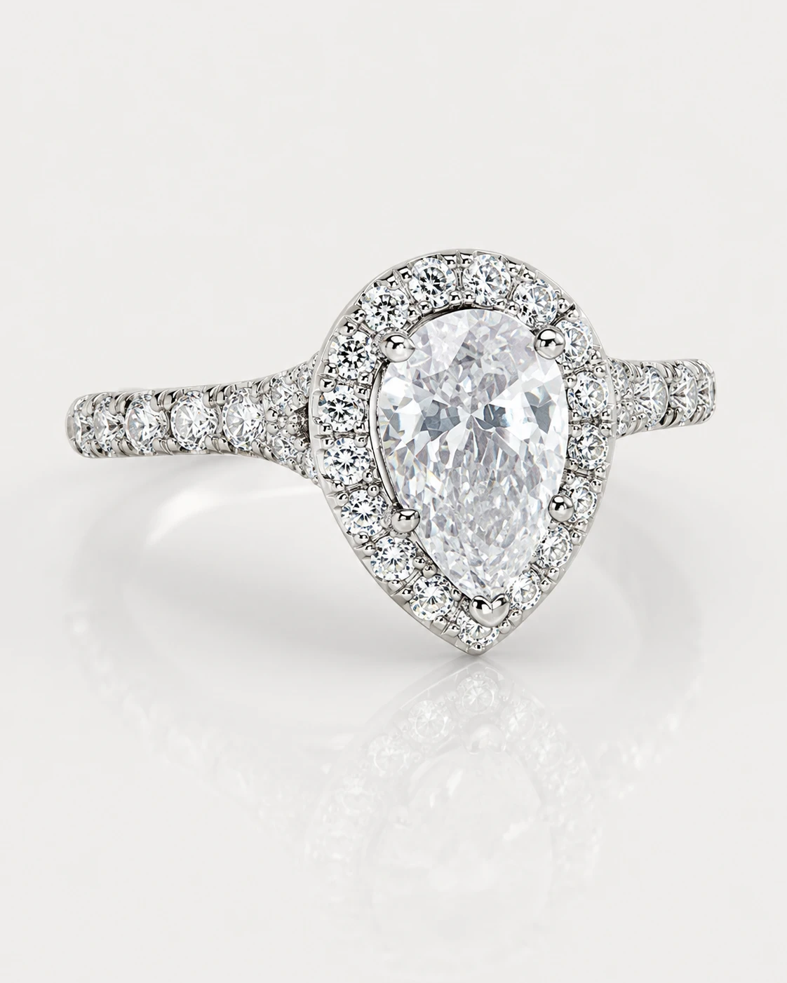 Pear-cut halo diamond engagement ring