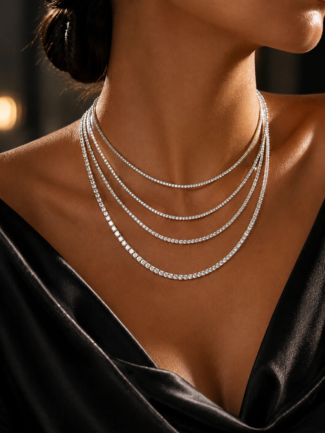 Layered diamond tennis necklaces, worn